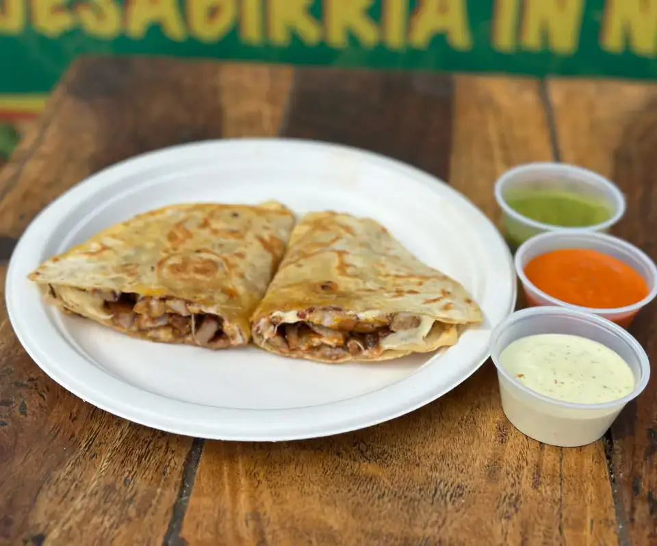 Mexican quesadilla from the menu at Los Tacos Hermanos on Canal Street in SoHo, NYC