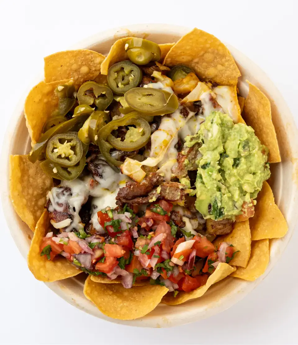 Mexican nachos from the menu at Los Tacos Hermanos on Canal Street in SoHo, NYC