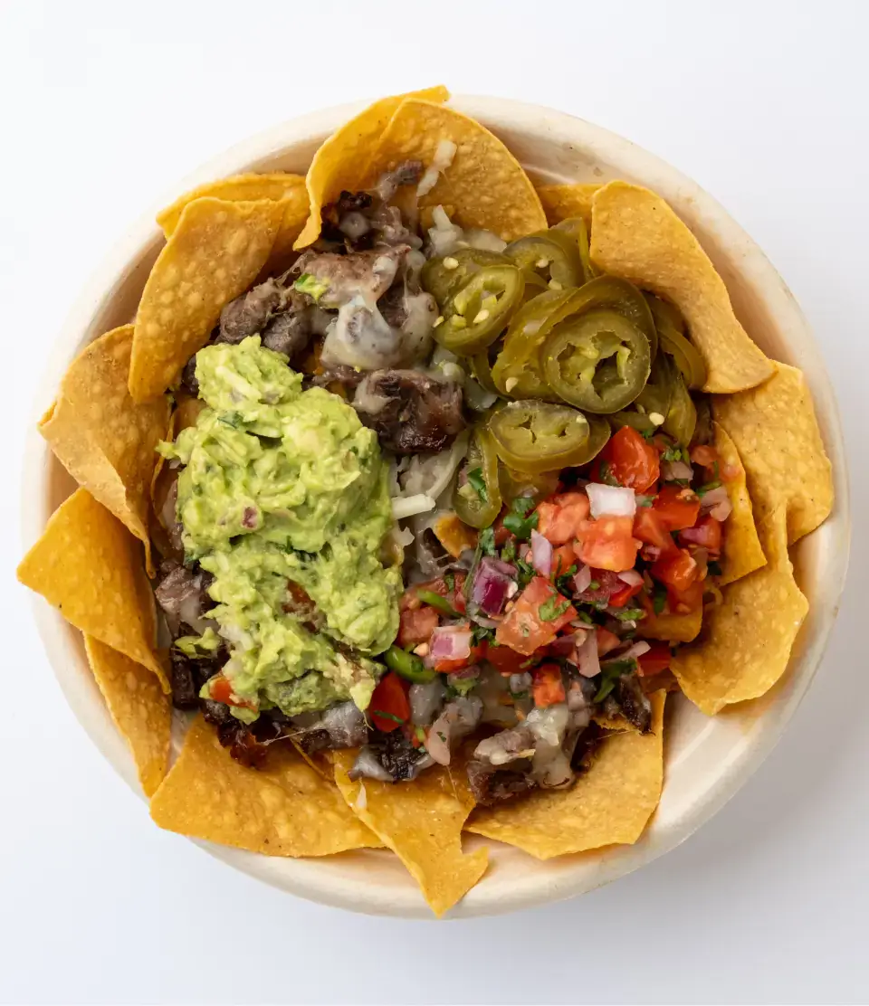 Mexican nachos from the menu at Los Tacos Hermanos on Canal Street in SoHo, NYC
