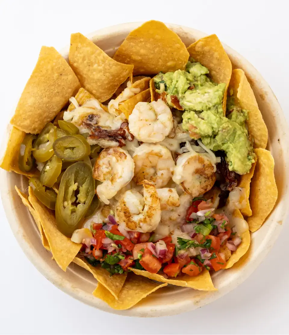 Mexican nachos from the menu at Los Tacos Hermanos on Canal Street in SoHo, NYC