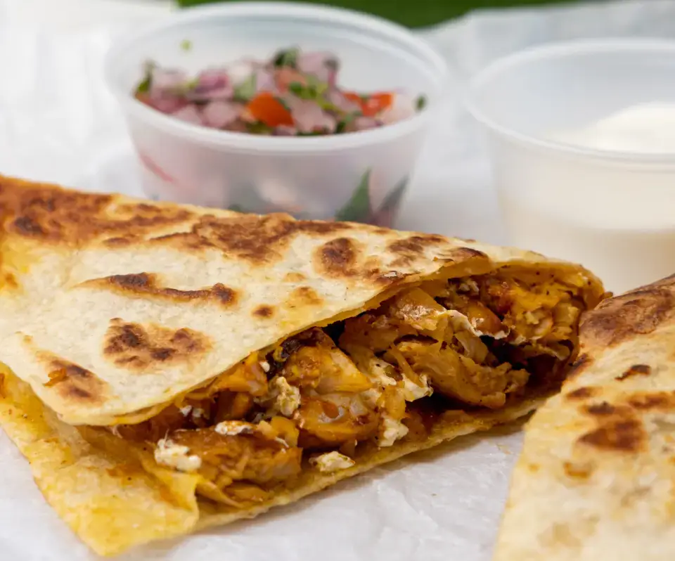 Chicken quesadilla with pico de gallo at Los Tacos Hermanos on Canal Street in SoHo, NYC