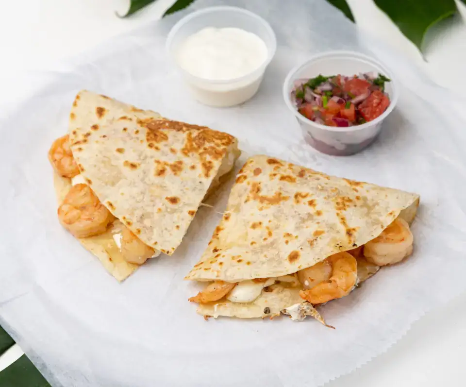 Mexican quesadilla from the menu at Los Tacos Hermanos on Canal Street in SoHo, NYC