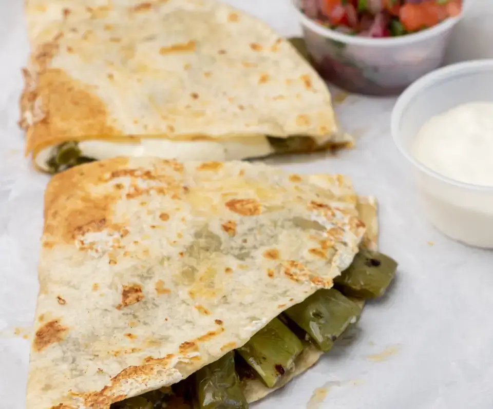 Mexican quesadilla from the menu at Los Tacos Hermanos on Canal Street in SoHo, NYC
